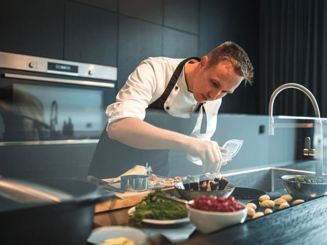 Private chef cooking for guests